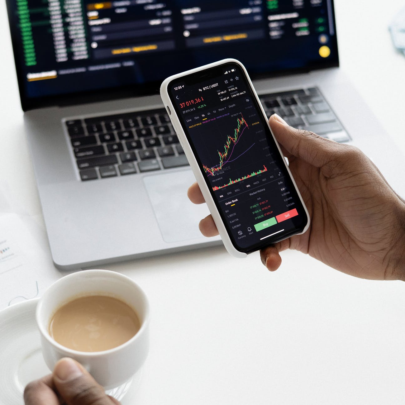 photo of person holding ceramic mug